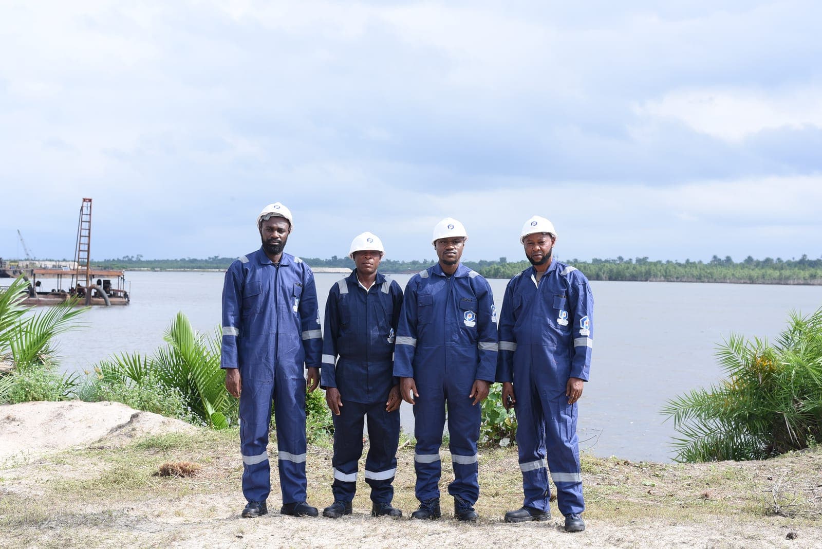 Peakware Offshore crew in PPE by the water