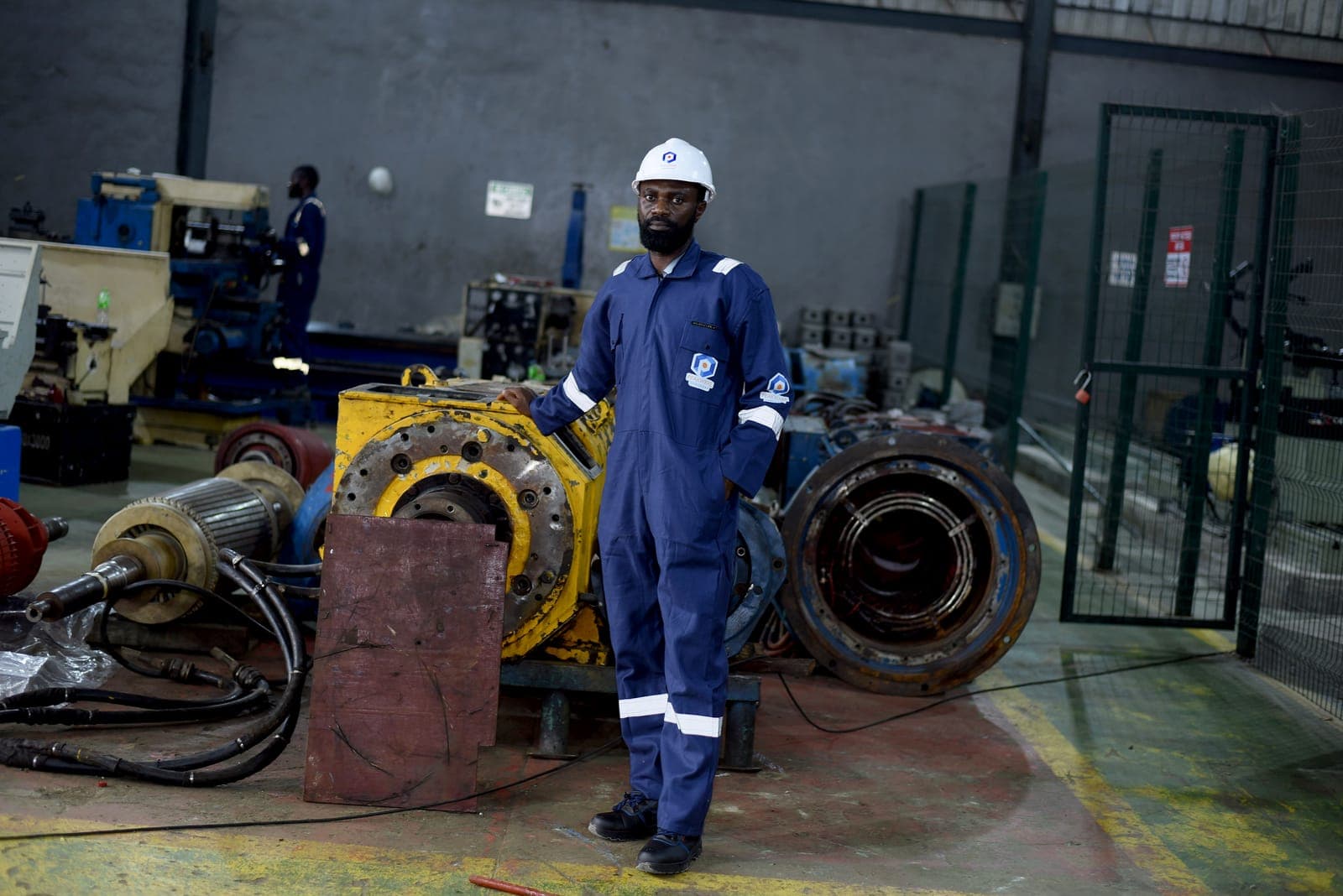 Technician working on a large rotor shaft