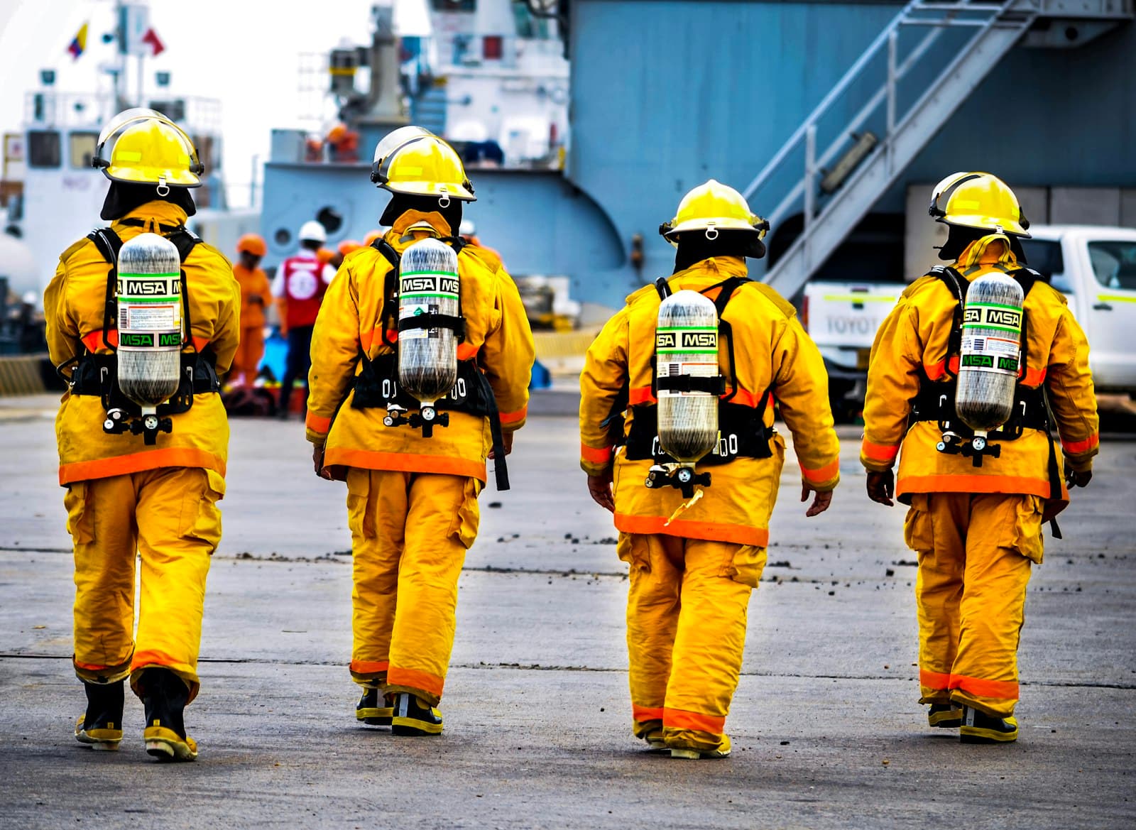 Industrial crew in full personal protective equipment arriving on site